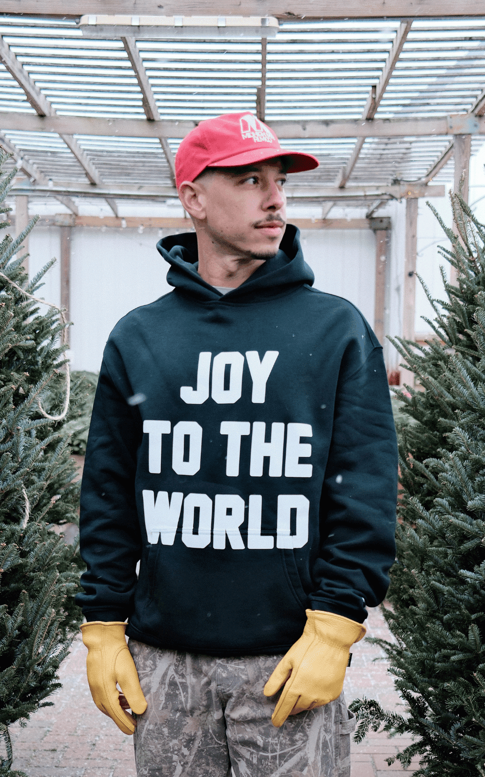 black man smiling and hugging a white man at a scatter joy event that supports mental health care and makes it more affordable and accessible for people