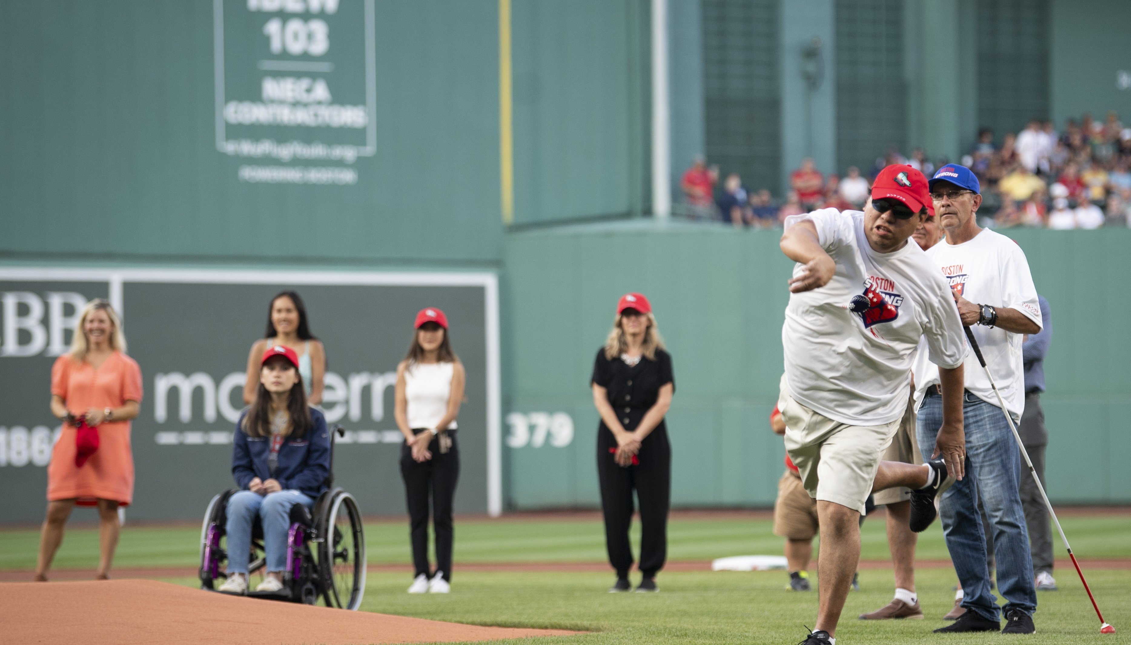 Boston Strong Head Coach Joe Quintanilla throws out the first pitch at Fenway Park