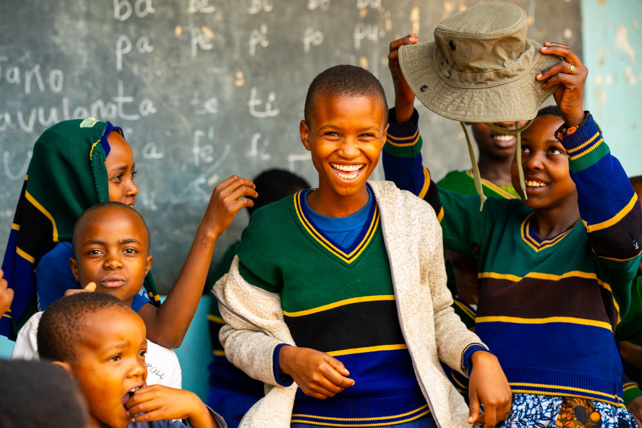 A group of smiling students standing together, radiating joy and confidence.